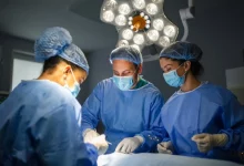 a group of surgeons in a operating room